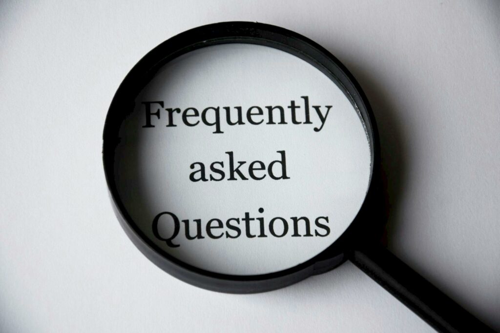a magnifying glass with words faq on it