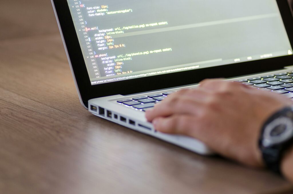 a person typing on a laptop
