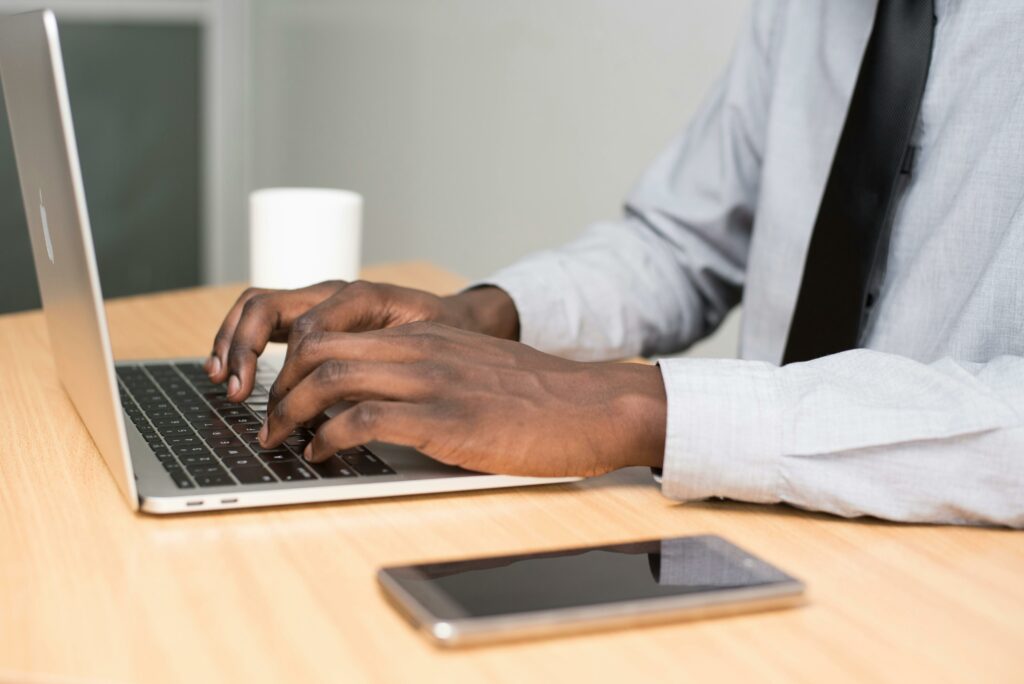 a person typing on a laptop