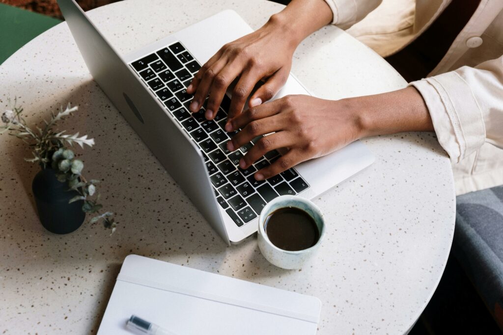 a person typing on a laptop