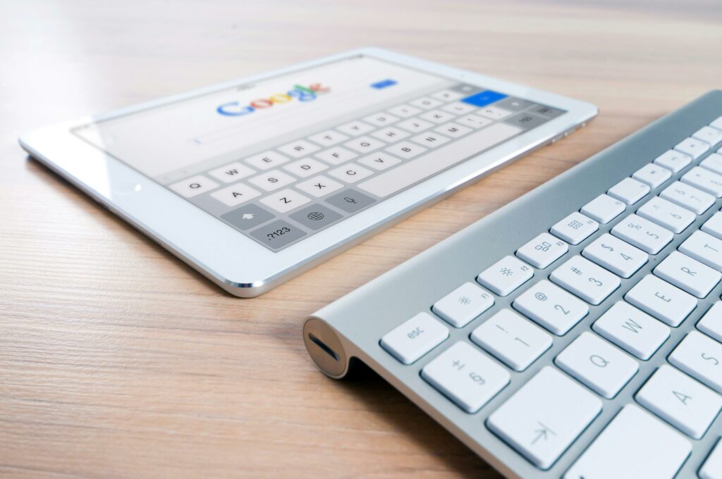 a keyboard next to a tablet