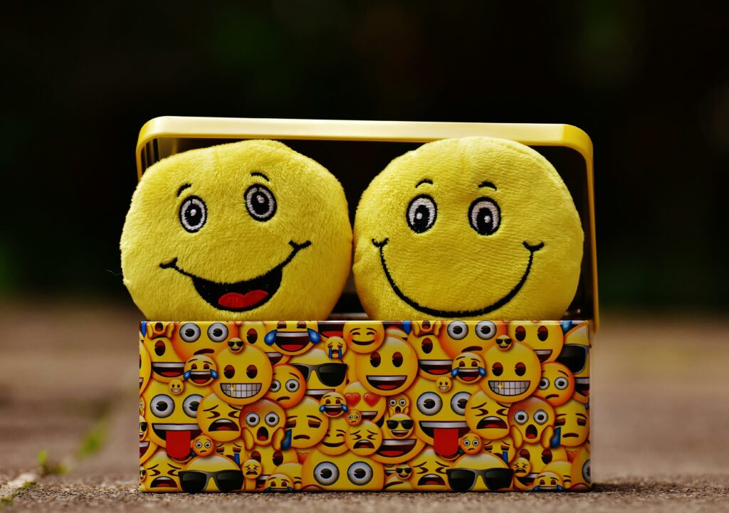 a yellow box with smiley faces in it