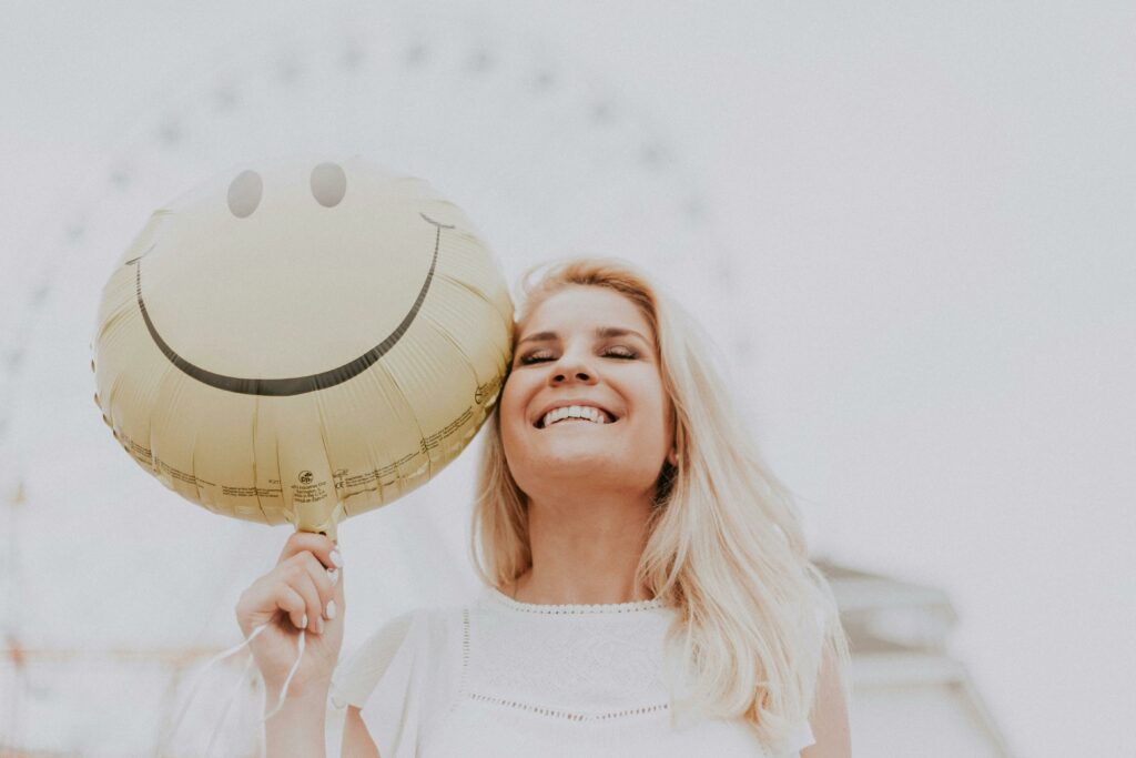 a woman holding a balloon