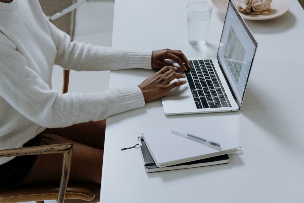 a person typing on a laptop