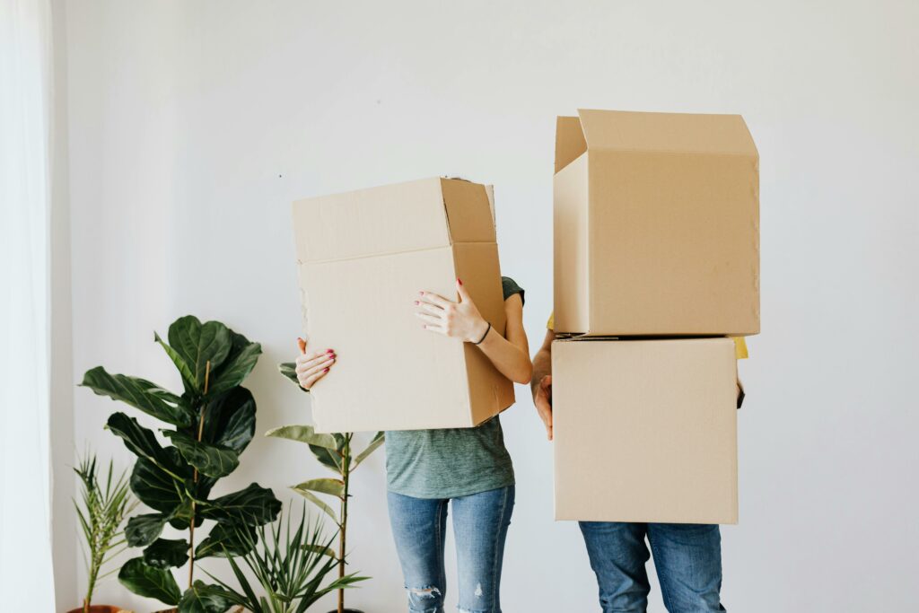 a couple of people holding boxes