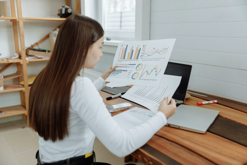 a woman looking at a paper