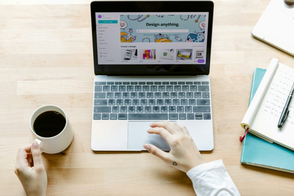 a hand on a laptop