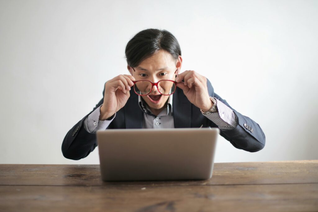 a man looking at a laptop