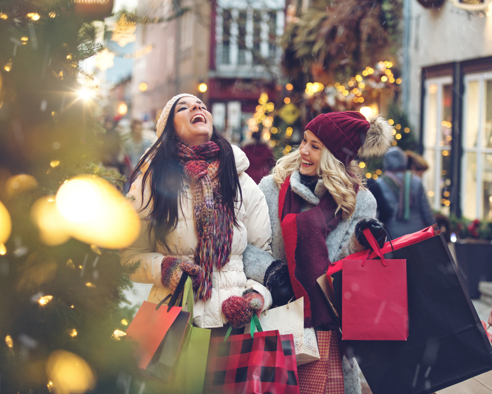 two women holding shopping bags