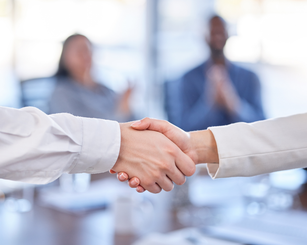 a close-up of people shaking hands