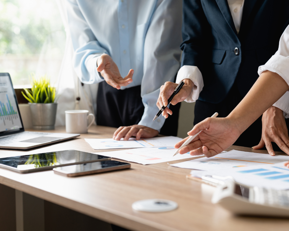a group of people working on a table