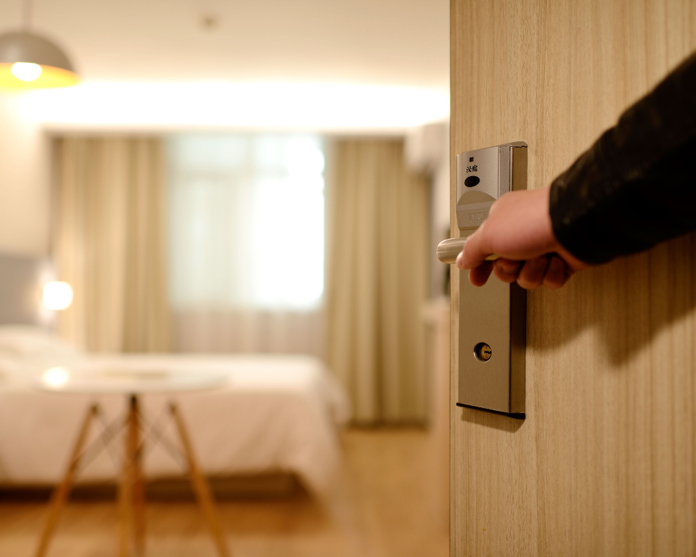 a hand holding a door handle
