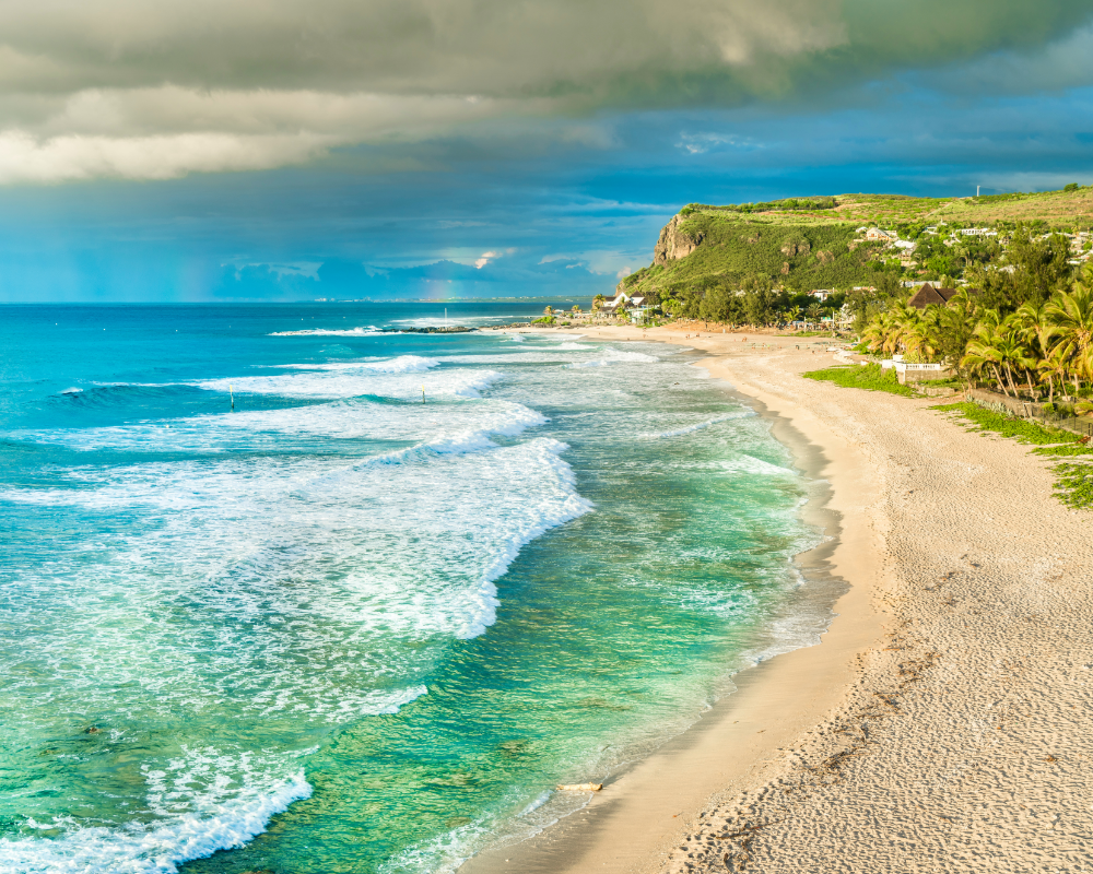 a beach with waves crashing on the shore