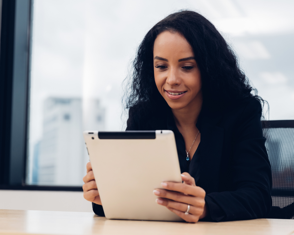 a woman looking at a tablet