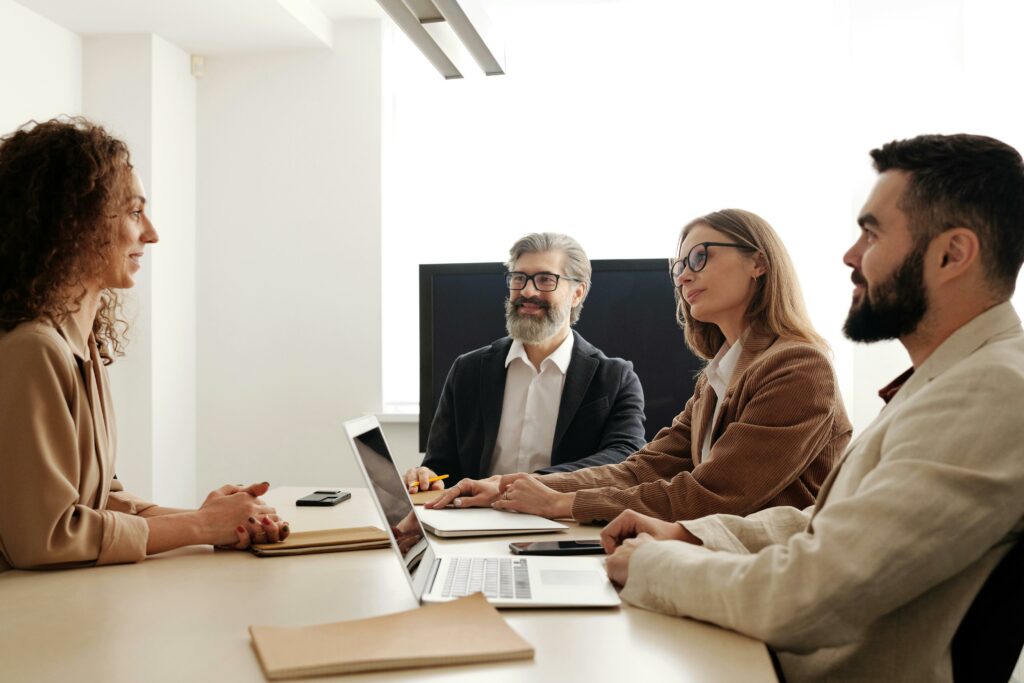 a group of people sitting around a table