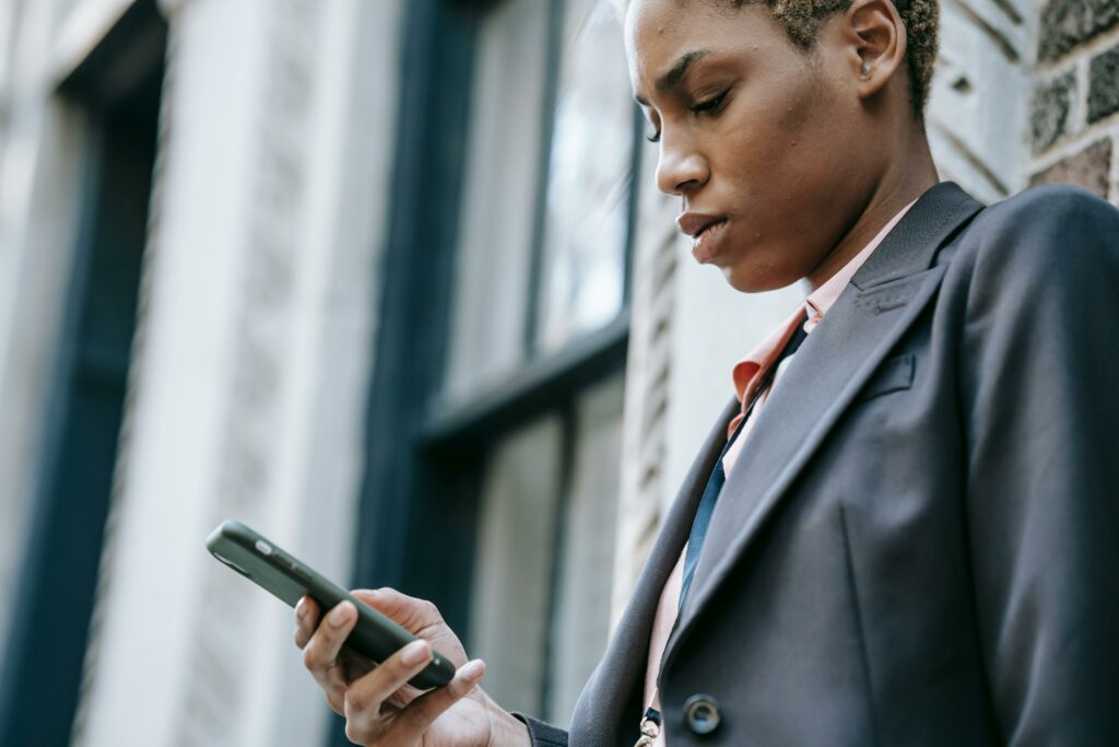 a woman looking at a cellphone